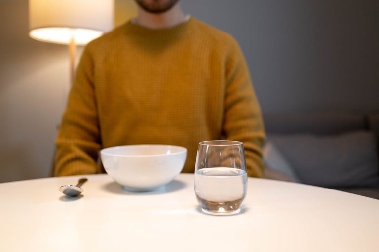 guy with empty bowl and glass of water: porn addiction signs body dysmorphia