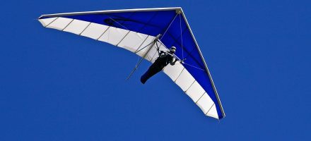 man hang gliding freely in blue sky - benefits of quitting porn